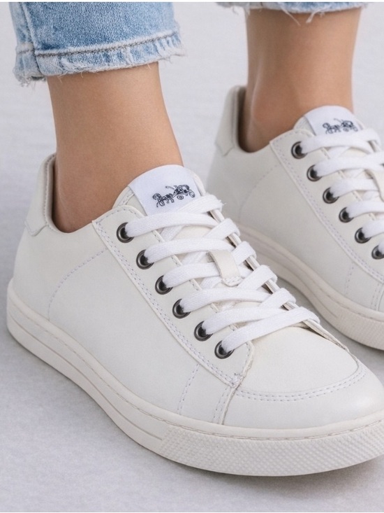 Coach Shoes - Women’s Coach Porter white leather low top sneakers with a lace-up design